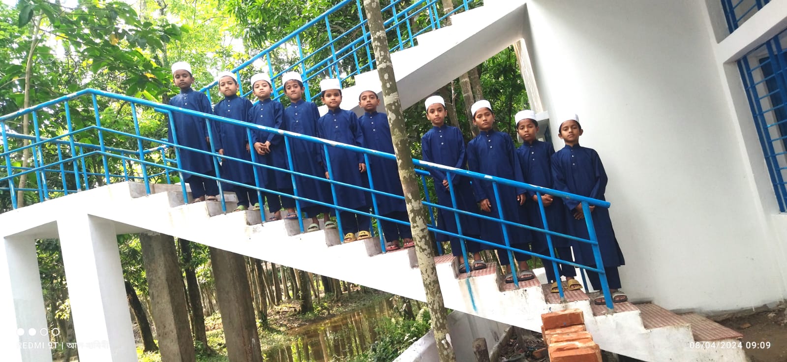 Students lined up on the facility staircase