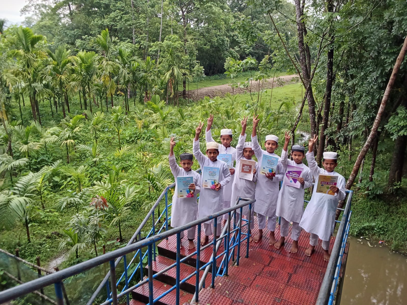 Students posing outdoors on the bridge